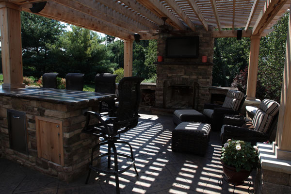 Outdoor Living Room and Kitchen Designed with Fireplace